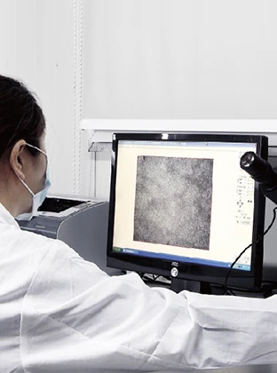 HWAMDA technician inspecting material microstructure