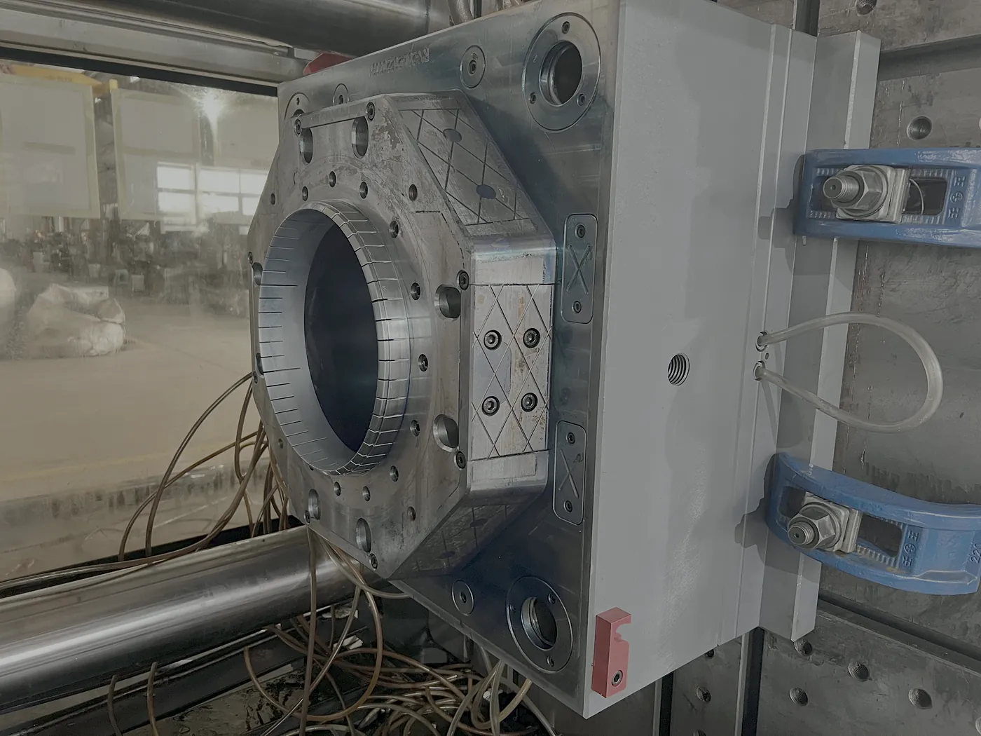 Close view of the 20 litre bucket body mold mounted on the machine platen