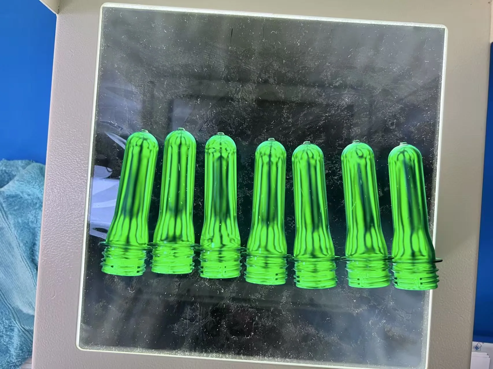 PET preforms inspected under polarized light after molding trial